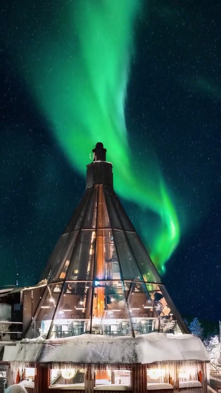 Aurora Borealis over Glass-Roofed Village