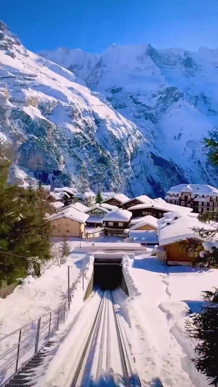 Scenic Mountain Train Journey Through Snowy Peaks
