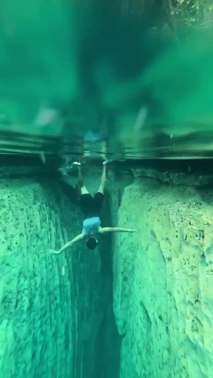 Underwater Cave Diving: Narrow Passages and Turquoise Water