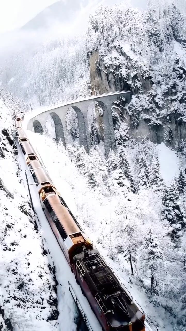 Spectacular Scenic Train Ride Through Snowy Mountains