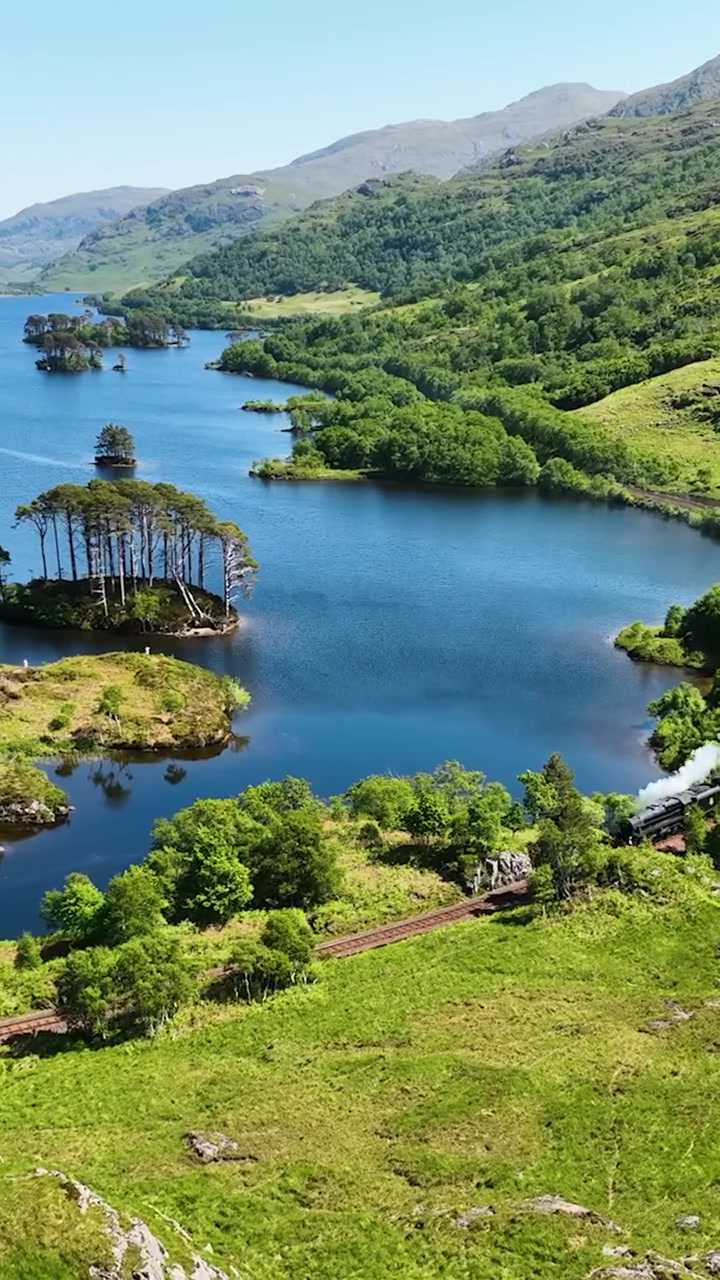 Scenic Train Ride Through Mountains and Lakes