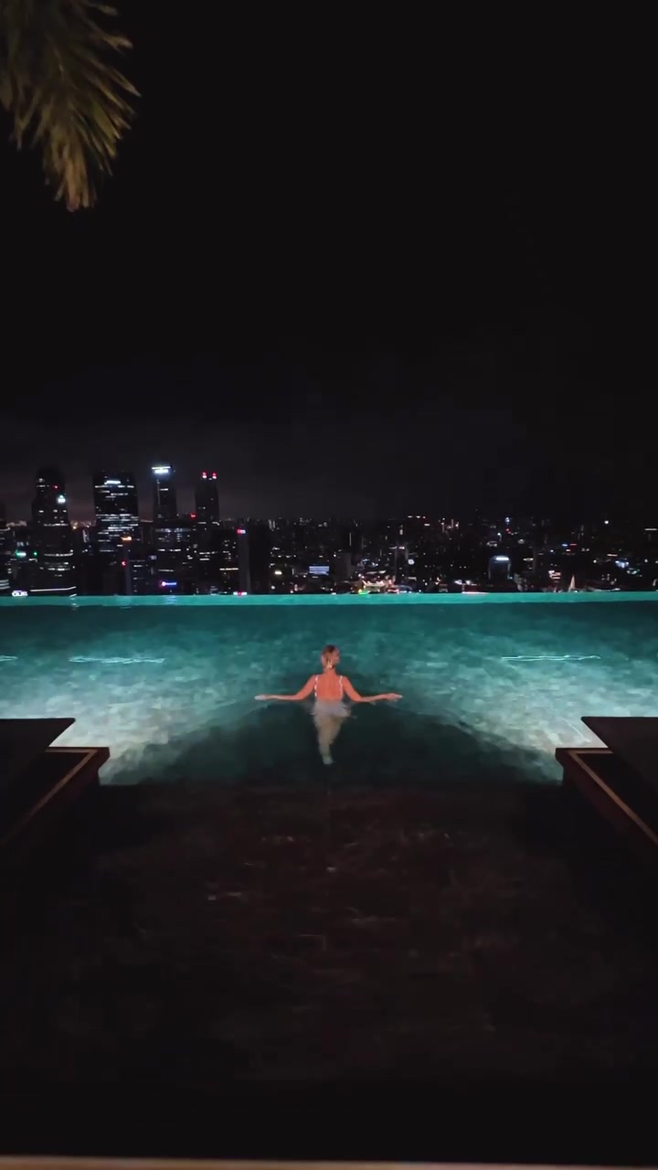 Rooftop Pool: Luxury City Views Day and Night