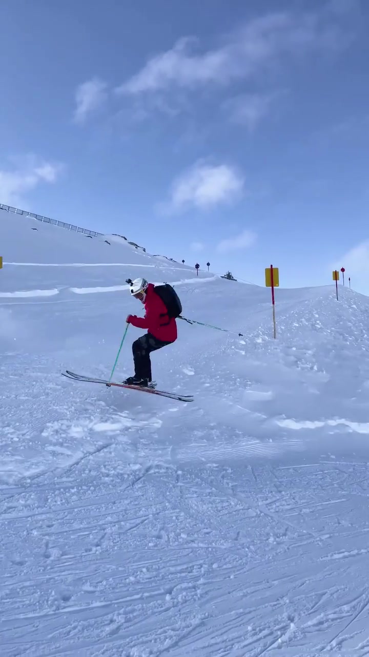 Skiing Down a Snowy Mountain Slope