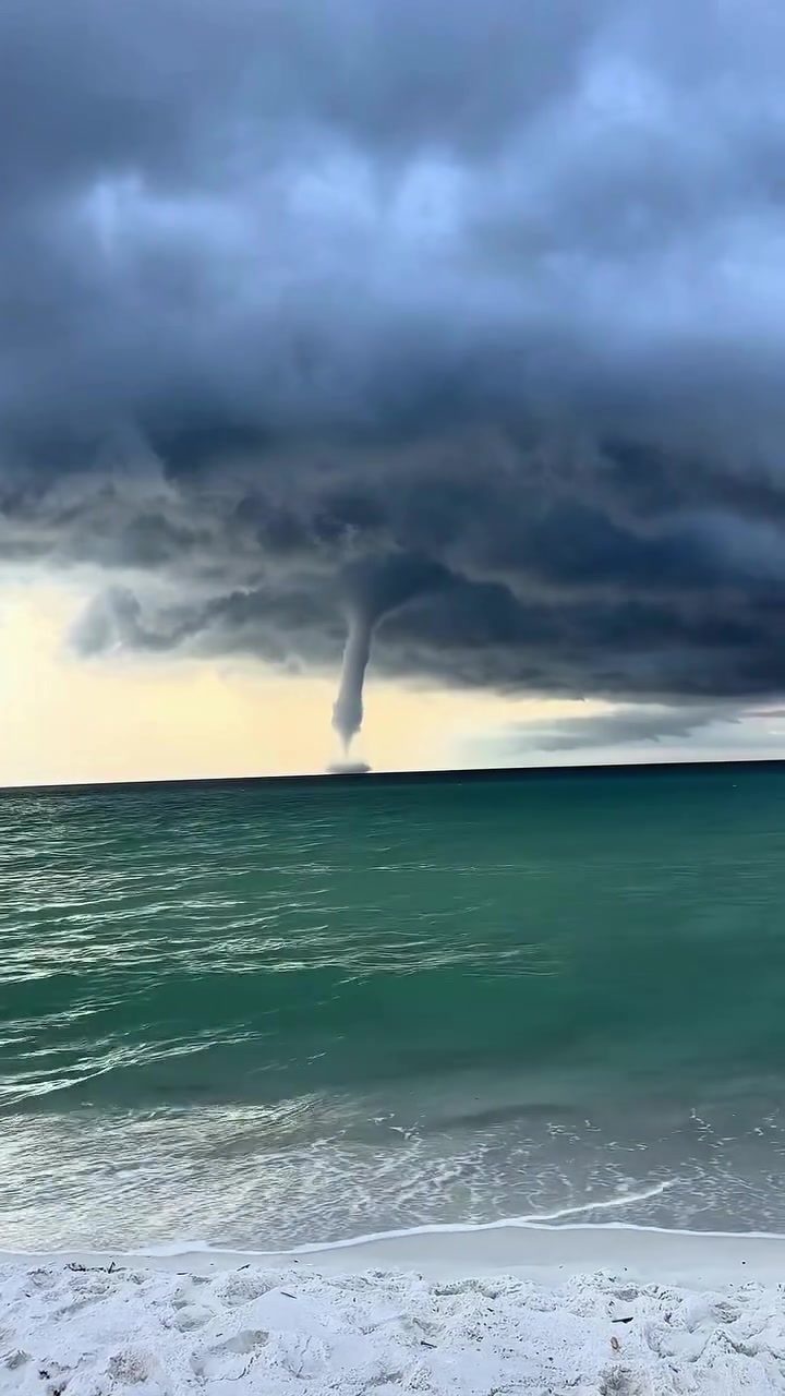 Waterspout Over Ocean: Dramatic Storm Phenomenon