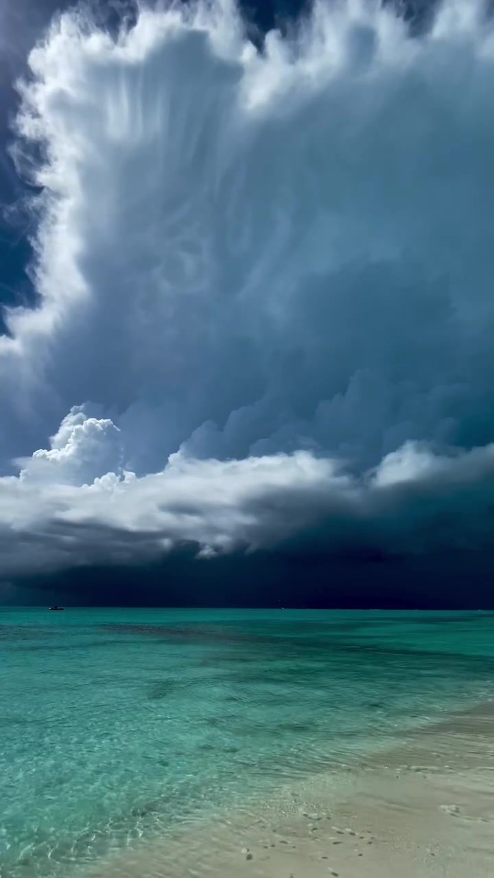 Stormy Skies over Turquoise Waters: The Magic of Summer Squalls