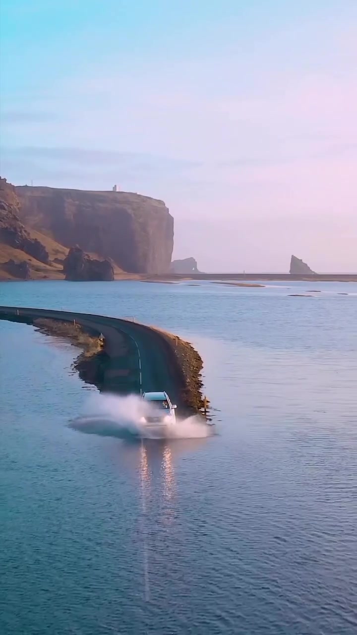 SUV Off-Roading Through Coastal Waters