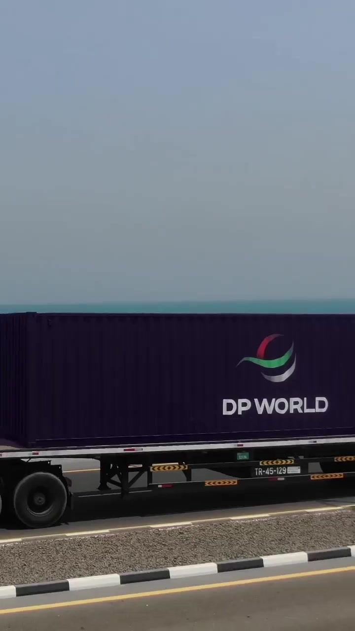 DP World's Truck Transporting Goods on Causeway