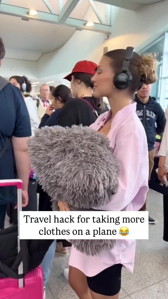 A Fluffy Blanket Travel Hack for Packing Fitted Clothes