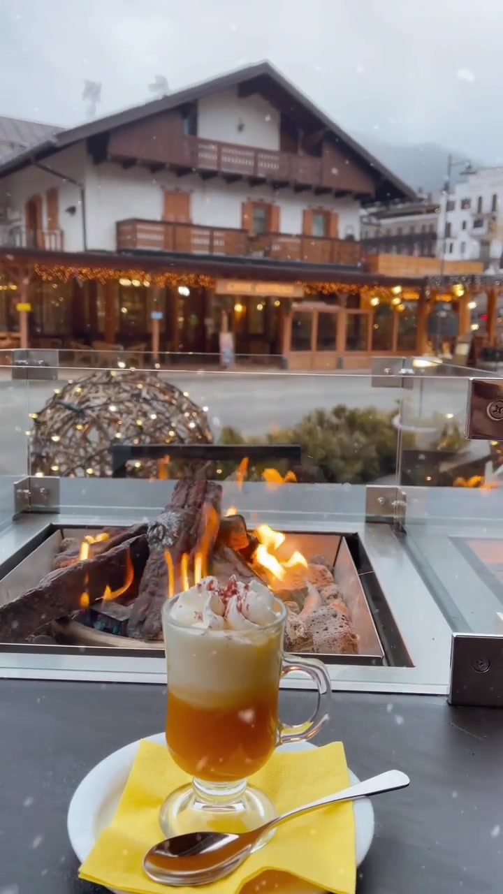 Cozy Winter: Enjoy a Warm Drink by the Fireplace