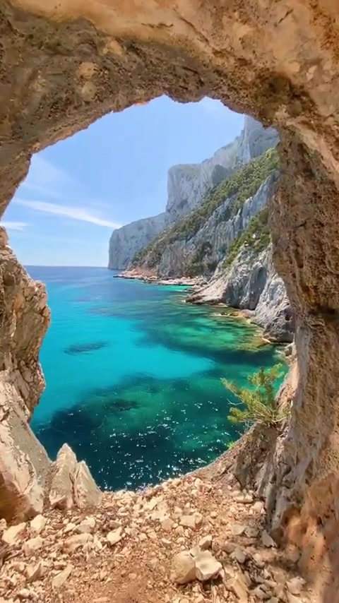 Coastal Landscape: Turquoise Sea and Rugged Cliffs
