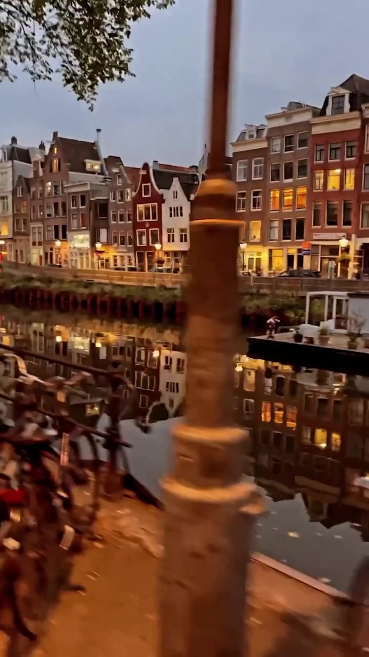 Amsterdam Canal View at Dusk: Scenic Dutch Architecture