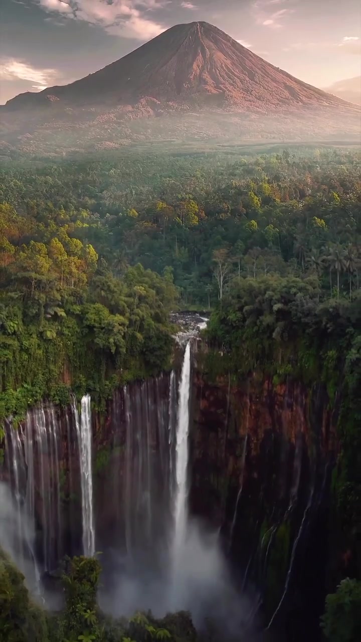 Aerial View of Waterfall and Volcano