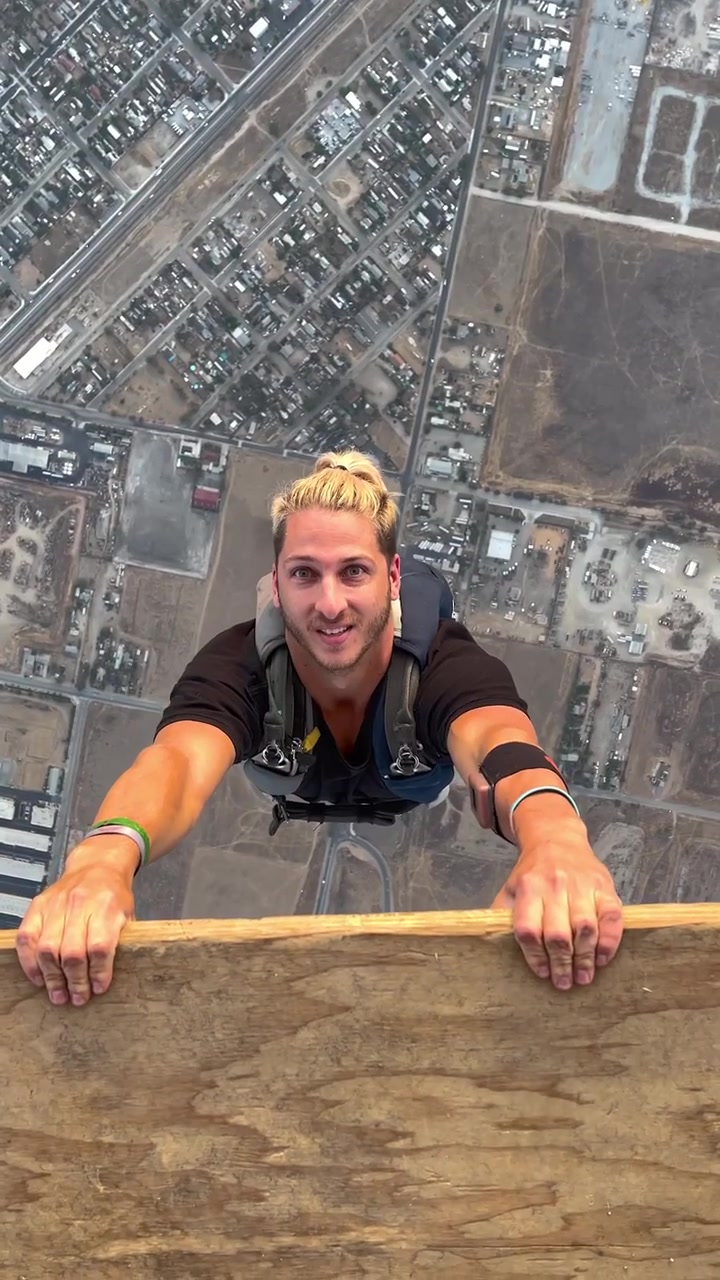 Skydiving from a High Altitude: Aerial Suburban View