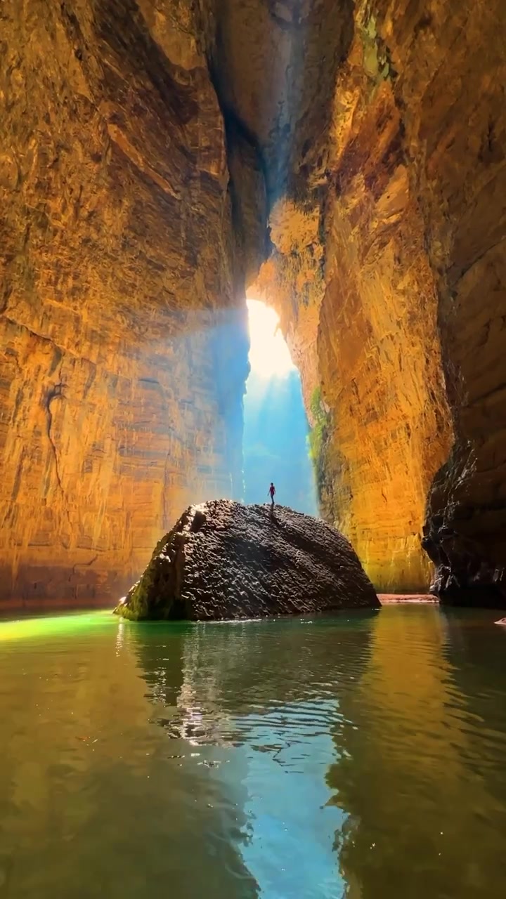 Canyon View: Man in Water, Sunlight Streaming