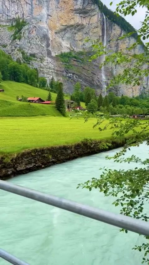 Swiss Landscape: Waterfall, Meadow, and Chalet Views