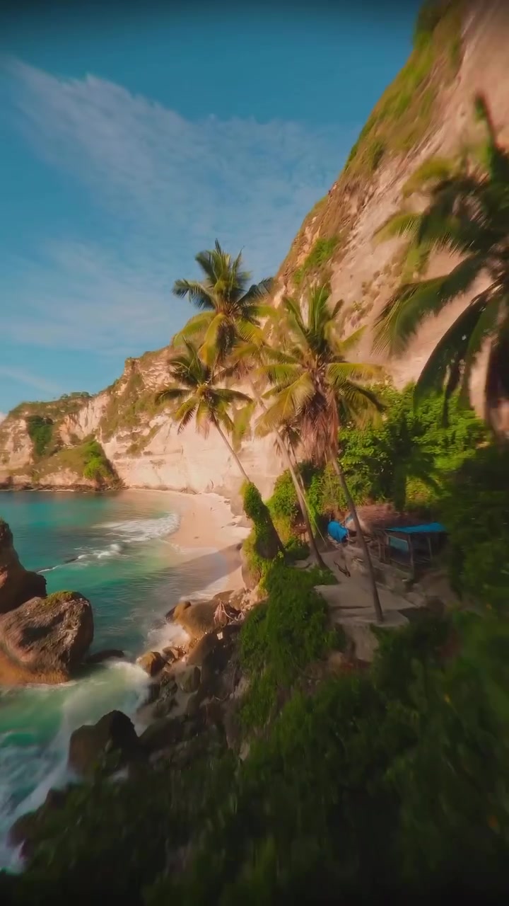 Aerial View of Secluded Beach Between Cliffs
