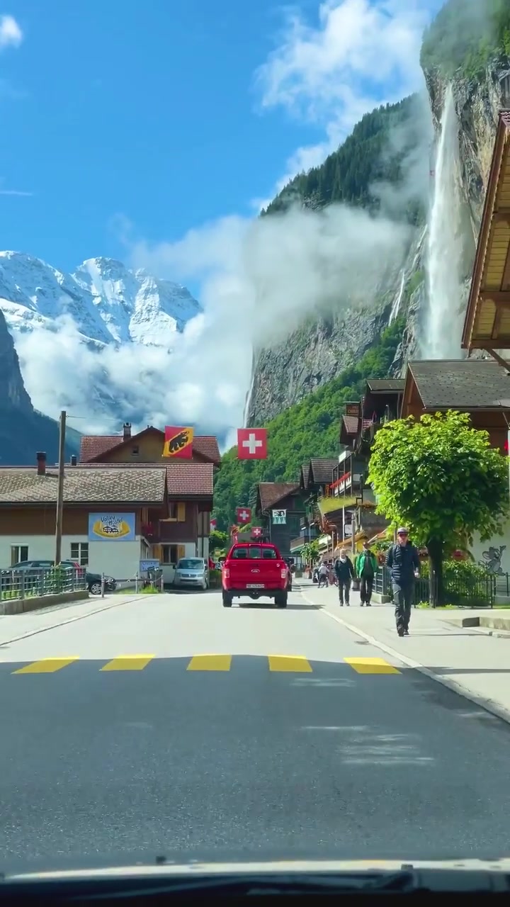 Swiss Village Landscape: Waterfall and Chalets