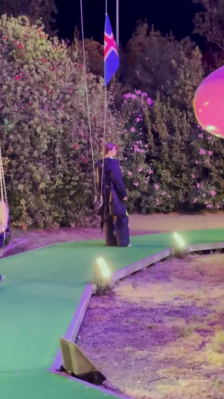 Nighttime Swing Ride Experience at Amusement Park