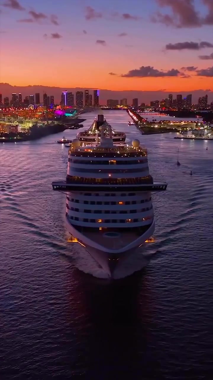 Cruise Ship Sunset Sailing Through City Skyline