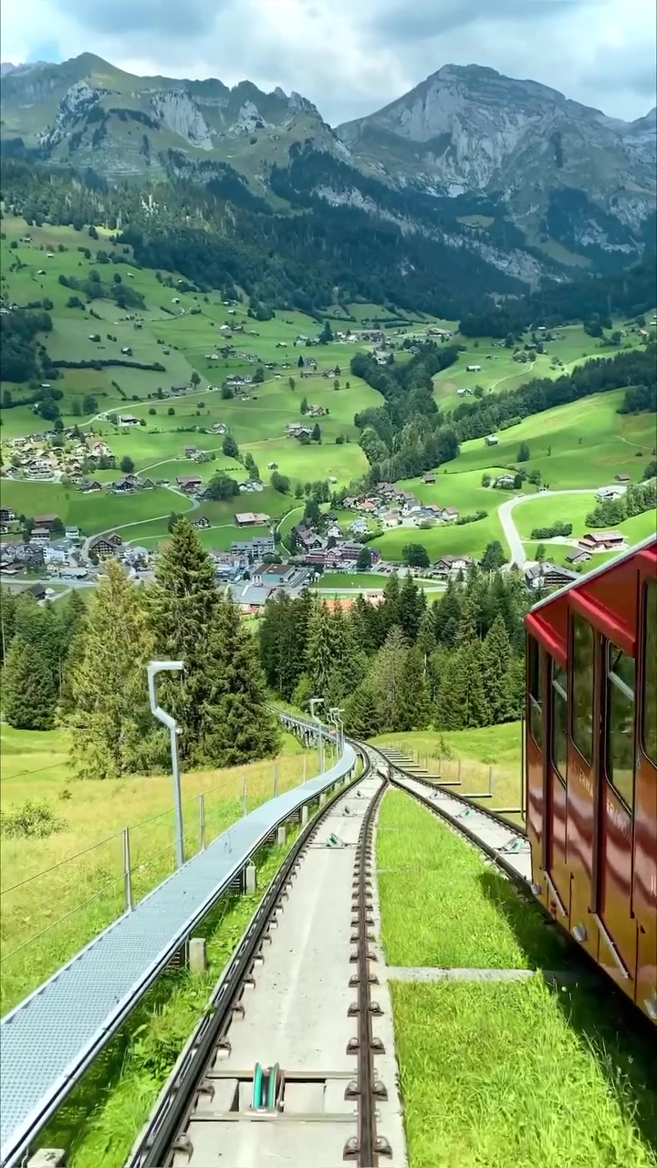 Switzerland's Scenic Train Ride Through Mountains