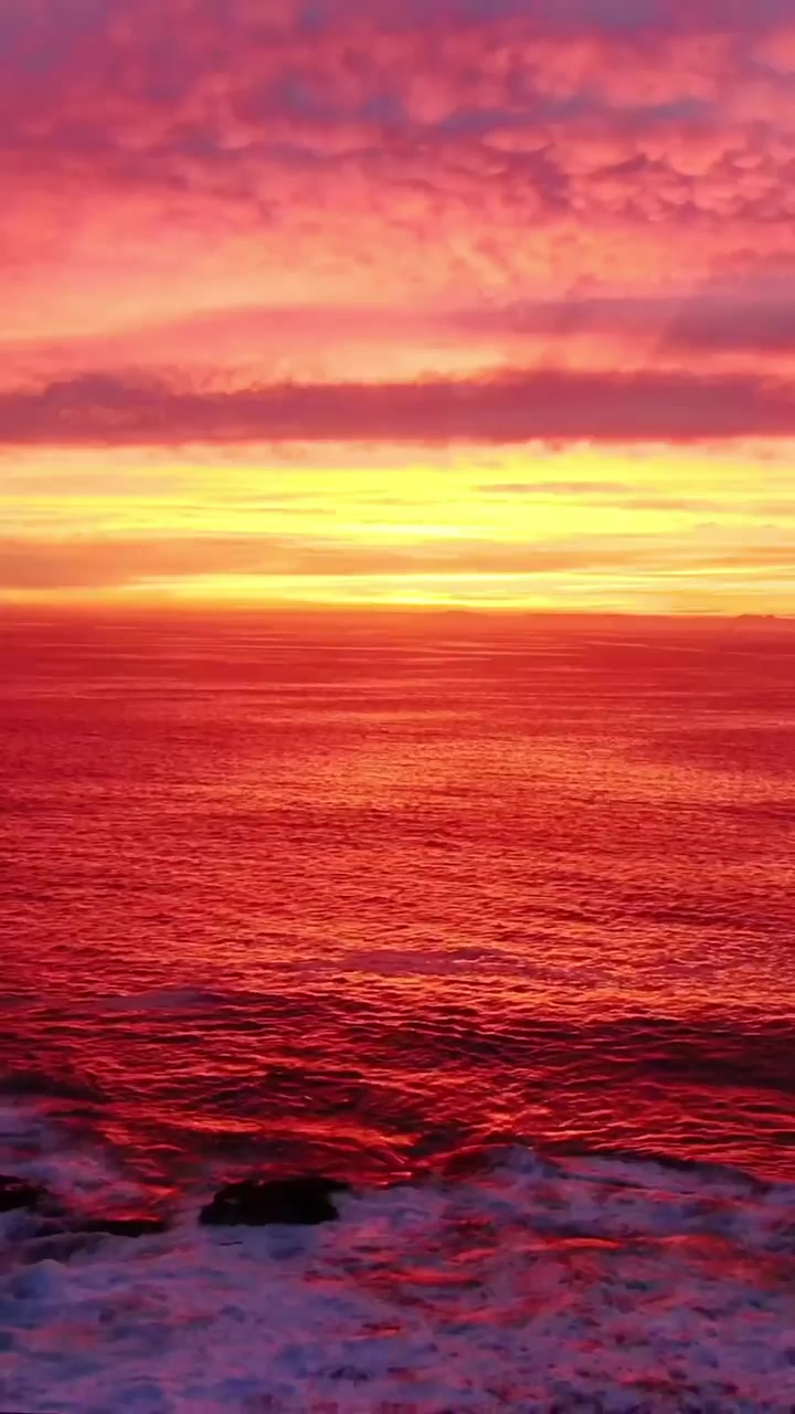 Sunset Ocean Views with Surfers and Waves