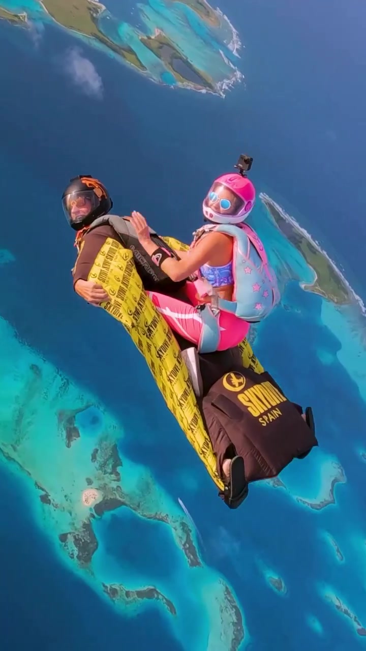 Tandem Skydiving Over Turquoise Ocean with Skydive Spain