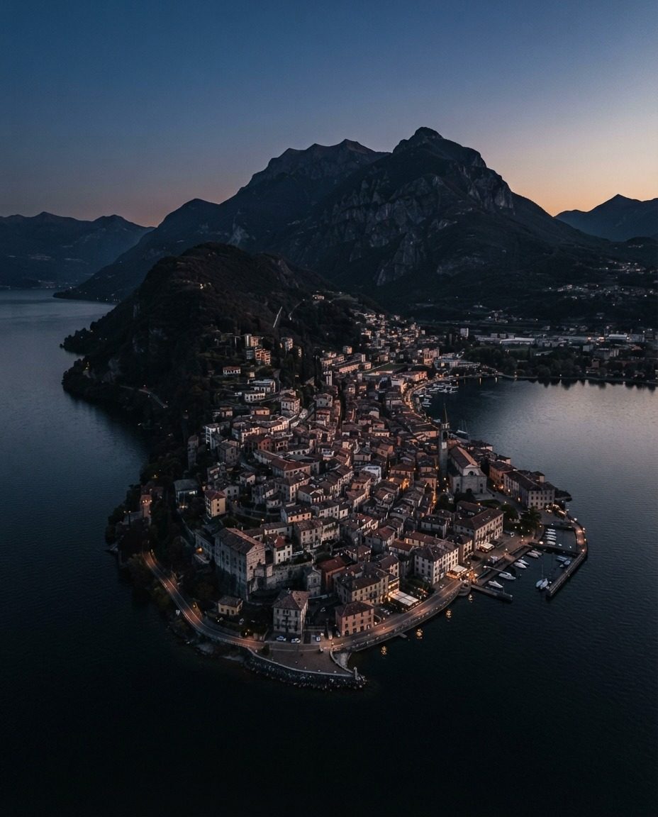 Aerial View of Lakeside Town with Mountain Backdrop