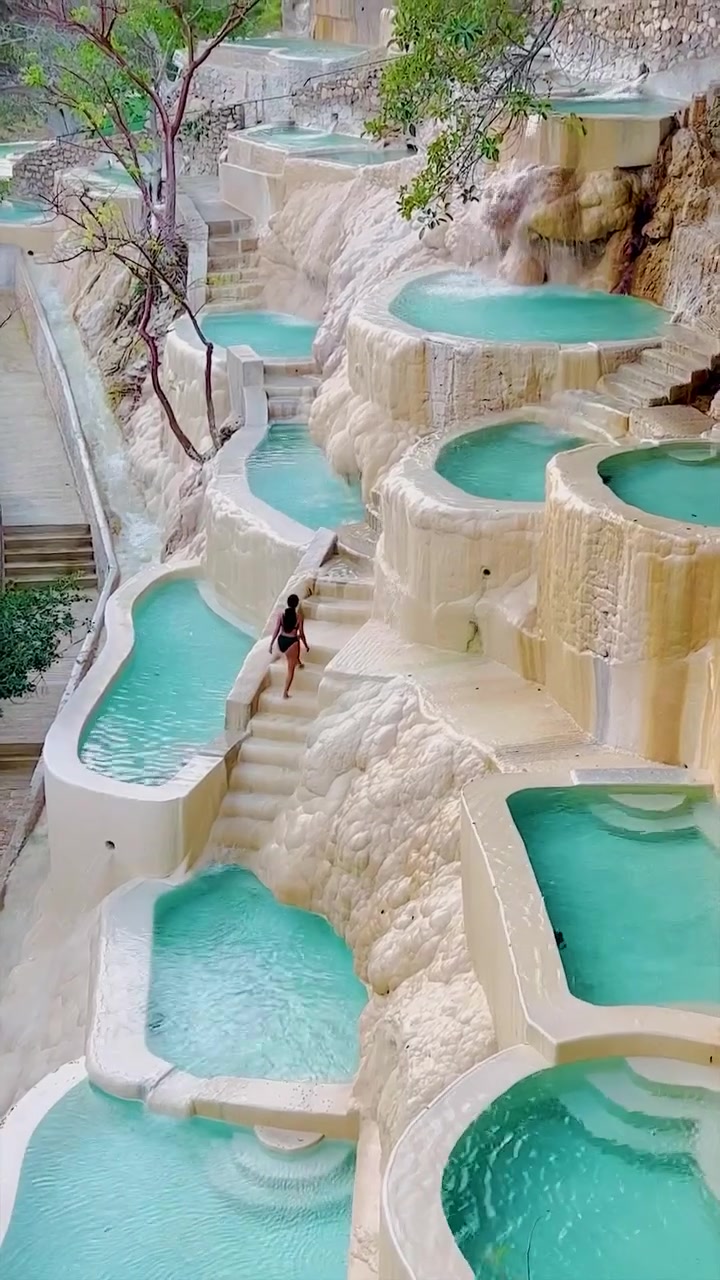 Turquoise Thermal Pools in Travertine Landscape