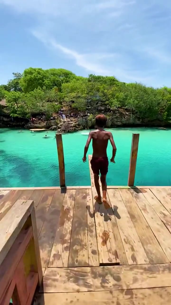 Cliff Jumping into Turquoise Water: A Thrilling Experience