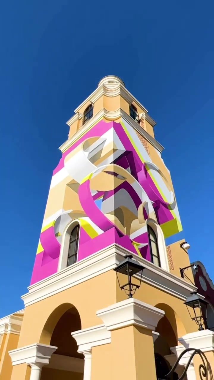 Exploring Vibrant Villano Tower with Artistic Umbrellas
