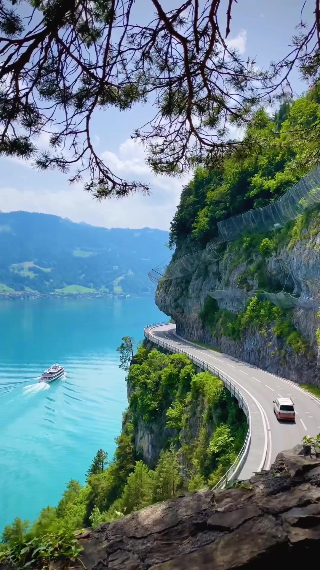 Scenic Mountain Road: Lake Views and Cliffside Driving