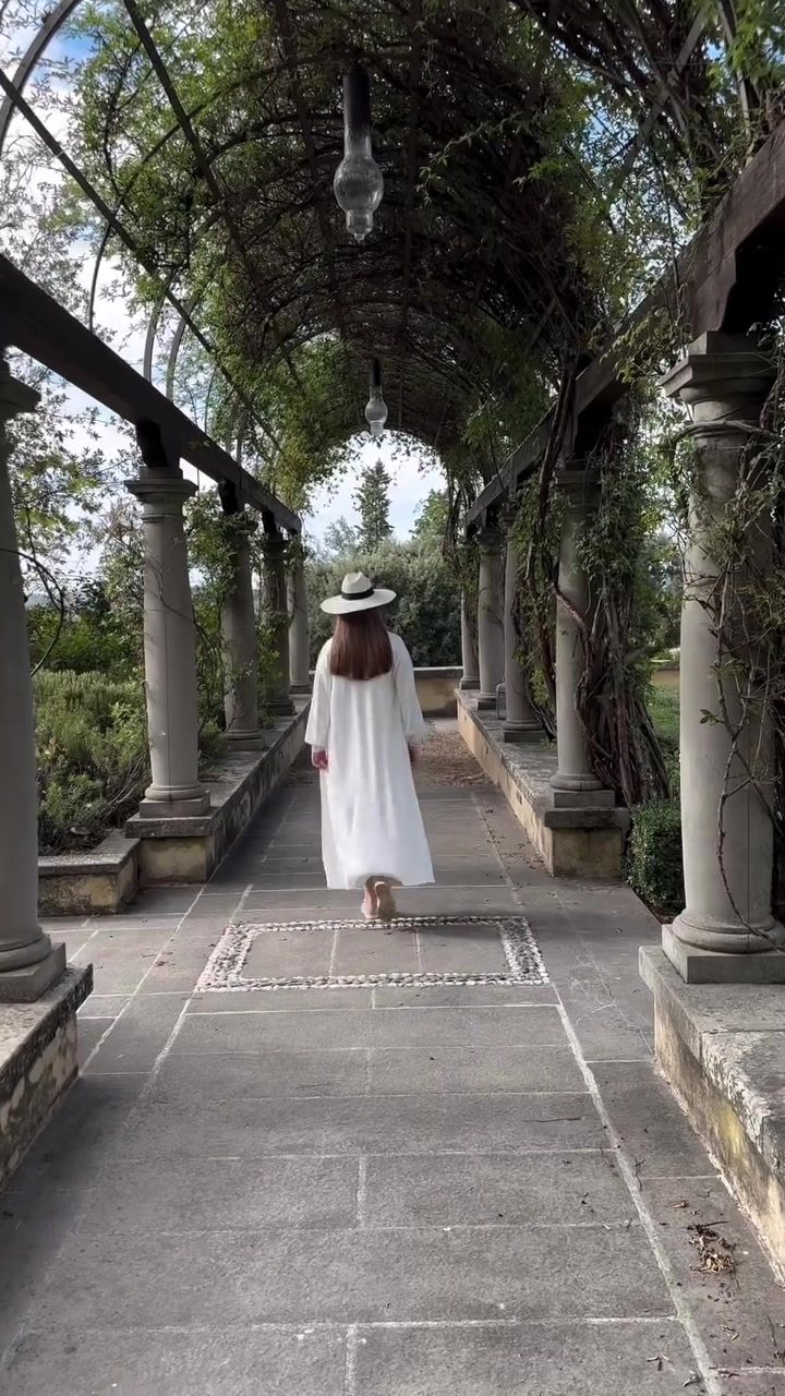 Elegant Walk Through a Greenery-Covered Archway