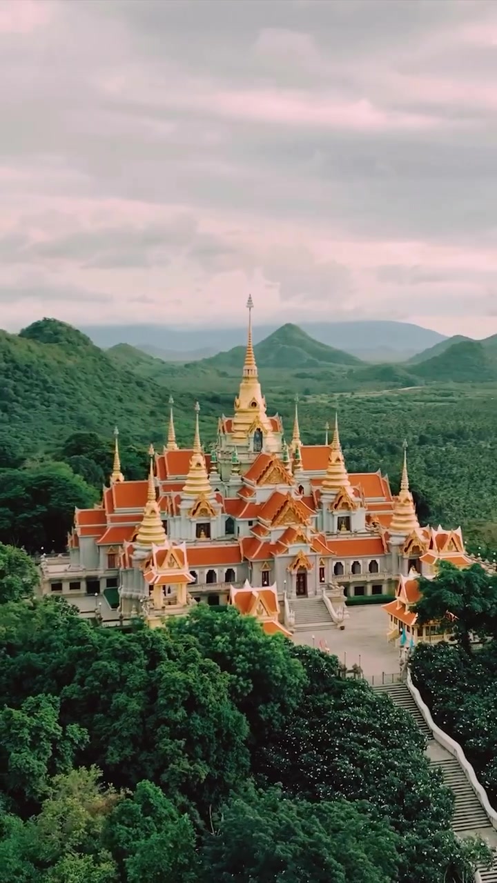 Temple Complex with Golden Spires and Mountain Views