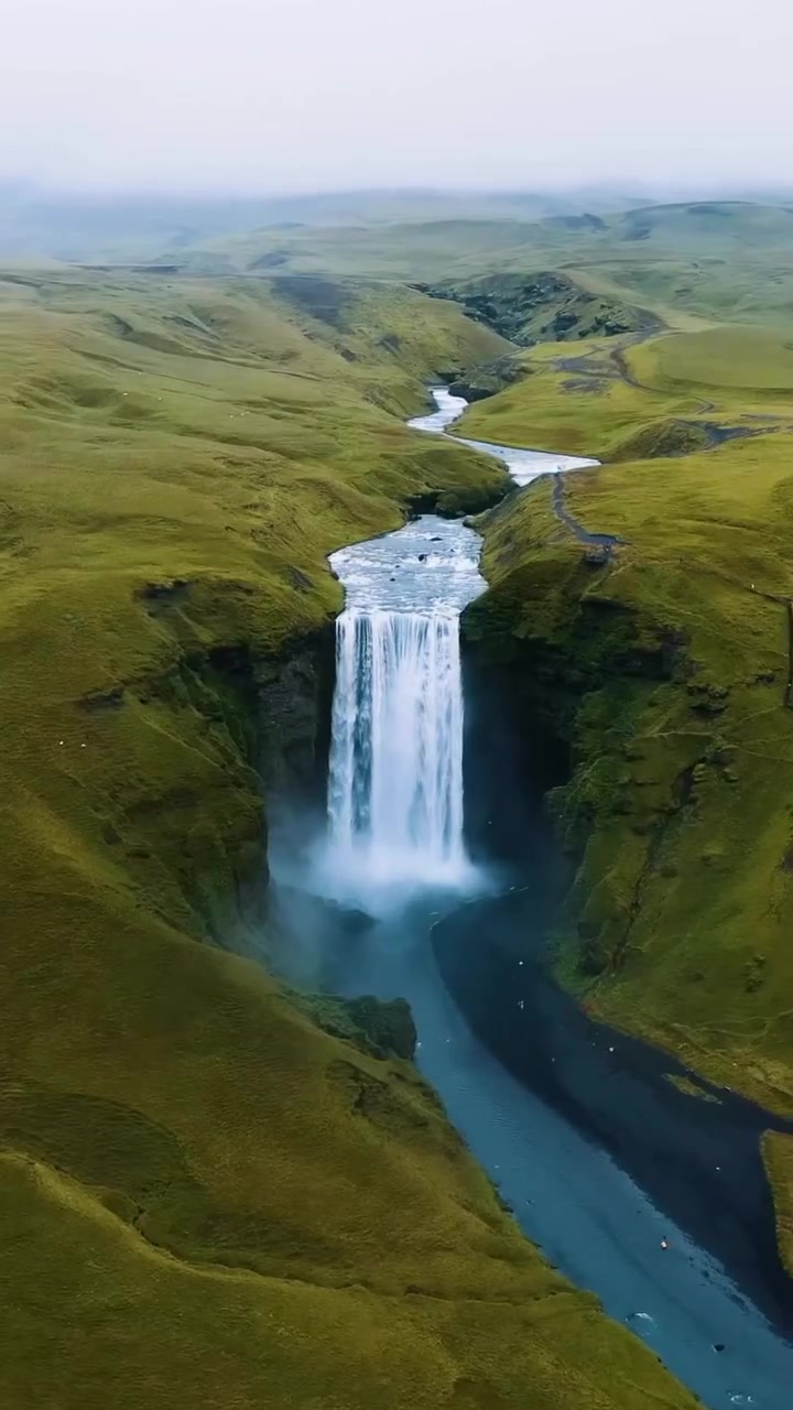 Aerial View of Waterfall and Green Hills